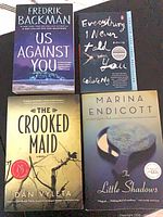 All four books front covers visible