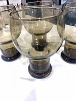 Four smoke-grey goblets front view