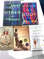 Five books laid out showing fronts