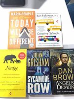 All five books laid out showing front covers