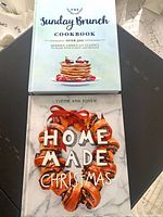 Front covers of both hardcover cookbooks
