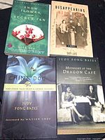 All four books front covers visible