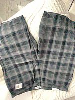 Full view of front and back of plaid shorts