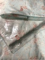 Folded floral fabric stack with one package in clear plastic