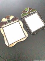 Both stained glass mirrors side by side showing design and colours