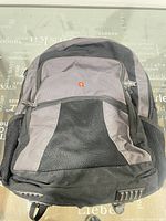 Front view of Swiss Gear backpack showing pockets and emblem