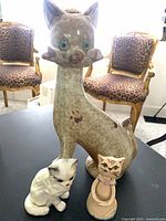 Group shot of all three cat figurines