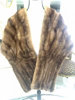 Front view of brown fur shoulder cape on mannequin