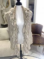 Front view of off-white/grey rabbit fur vest on mannequin