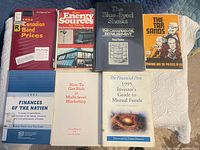 All seven books laid out showing front covers