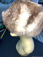 Side view of brown fur Stetson hat on mannequin head