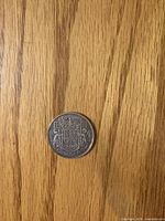 Reverse side showing 50 CENTS 1943 CANADA coat of arms