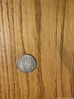 Reverse of 1962 Canadian 50-cent coin with coat of arms