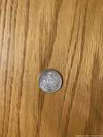 Reverse side showing Canadian Coat of Arms