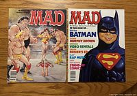 Front covers of both Mad magazines