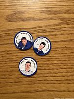Front view of three Toronto Maple Leafs 1966-67 player coins showing portraits and names