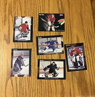 Fronts of six Blue Pics goalie cards laid out on table
