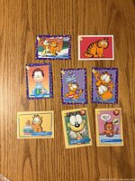Front view of eight Garfield SkyBox trading cards laid out