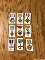 Front view of nine illustrated cigarette cards