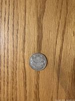 Reverse side showing coat of arms and date