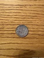 Reverse view showing Canadian coat of arms and 50 CENTS CANADA 1944 legend