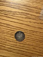 Reverse side showing Canadian Coat of Arms