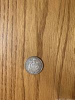 Reverse of 1966 Canadian 50-cent coin showing coat of arms