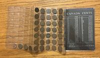 Fold-out sleeve holding rows of Canadian pennies with reference card visible