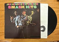 Front cover of Smash Hits LP with vinyl partially visible