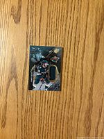 Front of Luke Kunin Rookie Materials card showing player images, jersey swatch and team logo