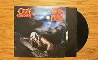 Front cover of Ozzy Osbourne Bark at the Moon album with vinyl partially visible