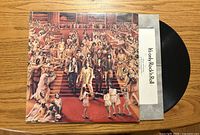 Front jacket artwork, partial vinyl and inner sleeve visible