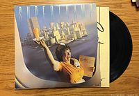 Front jacket of Supertramp Breakfast in America with vinyl partially visible