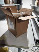 Cardboard box exterior showing antennas inside