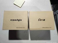 Closed boxes showing brand names esonstyle and fetta
