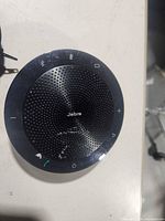 Top view of a Jabra Speak 510 showing grille and control icons