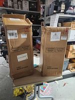 Two shipping cartons containing the lanterns