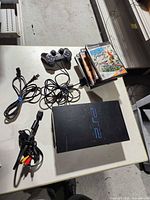 Console, controller, power cord, AV cable, five game cases