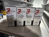 Front view showing four sealed Accounting Toner Cartridge boxes