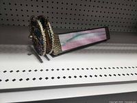 Side view of stained glass kaleidoscope showing body and rotary wheel