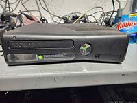 Front view of Xbox 360 Elite console showing disc drive and power button