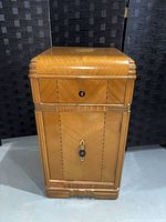 Full front view showing overall design, drawer, door and moulding