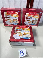 Three boxed sets of Coca-Cola Arctic Bears salad/dessert plates