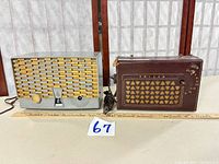 Front view of Emerson grey radio and Philco brown leather radio together with scale