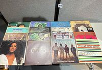 Full layout of 16 LP sleeves on table