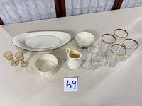 Group shot of all porcelain pieces and glassware on table