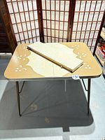 top view of table with removable leaf placed on surface