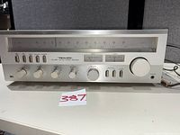 Front view of Realistic STA-820 receiver showing faceplate, controls, tuning dial and meters