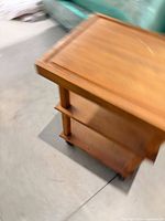 overall blurred view showing three tiers and casters