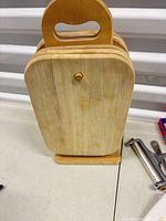 Wooden cutting board set on stand